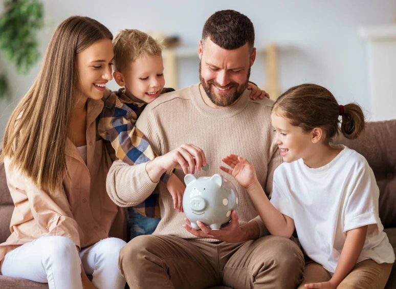 Parents with kids and piggy bank
